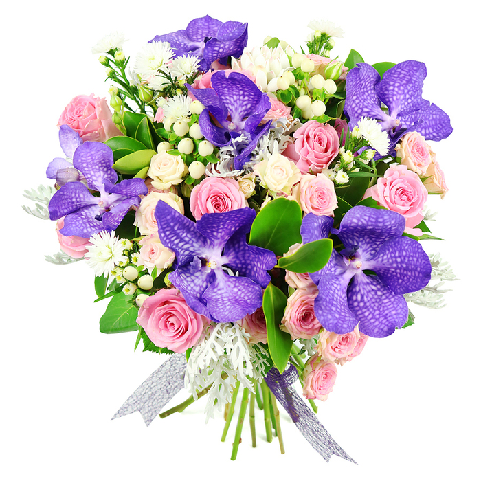This image shows a meticulously arranged bouquet set against a smooth white background, where each blossom and leaf is clearly defined. The design is anchored by several dramatic Vanda orchids, their petals broad and slightly ruffled, saturated in deep violet tones with intricate speckling and fine veins that give them a distinctive, almost couture appearance. Nestled around these orchids are soft pastel pink roses in varying stages of bloom, from tight buds promising fragrance to fully opened flowers with layered, romantic petals. Creamy white spray roses are woven throughout, their smaller heads clustered in groups that lend fullness, lightness, and an elegant contrast to the darker purples. Tiny white filler flowers, reminiscent of asters or miniature daisies, peep from between the larger blooms, while clusters of smooth, pearl-like white hypericum berries introduce rounded, sculptural accents. The bouquet is softened further by the inclusion of dusty miller foliage, its silvery-grey leaves velvety to the eye, bringing a cool, misty element to the colour palette. Deep, glossy green leaves surround and support the flowers, ensuring the arrangement looks abundant and grounded. The stems are neatly bound and finished with a shimmering ribbon that shifts between silver and pale lavender, adding a final touch of refinement. This bouquet feels ideal for an elegant celebration in Mill Hill-a special anniversary dinner near The Ridgeway or a memorable birthday gift delivered to a home just off Watford Way. The interplay of rich purples, gentle pinks, and luminous whites, combined with varied textures, reflects expert floristry and makes the bouquet suitable for marking cherished milestones across the NW7 community.