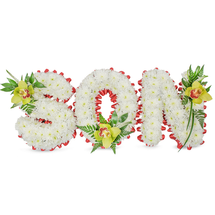 A handcrafted memorial piece spells out 'SON' in generous three-dimensional letters, each face built from a compact field of immaculate white chrysanthemums that read as soft, clouded planes when viewed from a short distance. The chrysanthemums' fine, overlapping petals create a tactile, almost velvety texture, while a continuous, scalloped red ribbon is worked around every letter's edge - folded and looped with exacting care to provide a bold, protective outline that complements the white without diminishing its quiet dignity. At three precise points - the upper left of the 'S', the inner base of the 'O' and the upper right of the 'N' - we placed lime to yellow-green cymbidium orchids, their waxy petals and the delicate orange to reddish markings in each flower's throat offering a warm counterpoint to the arrangement's cool whites. Rich green leaves and airy fern fronds cascade subtly around and between letters, their textures ranging from glossy, elongated blades to lacy fern tips, which together introduce contrast, height and a natural rhythm. The whole composition is set against a clean white field so details like ribbon scallops, orchid throats and the chrysanthemums' layered anatomy are clearly readable - the kind of thoughtful tribute seen at funeral services, remembrance gatherings or graveside displays. As a Mill Hill-based florist crafting for local families near The Ridgeway and Bittacy Hill, I aim for balance between formality and intimate expression in pieces like this.