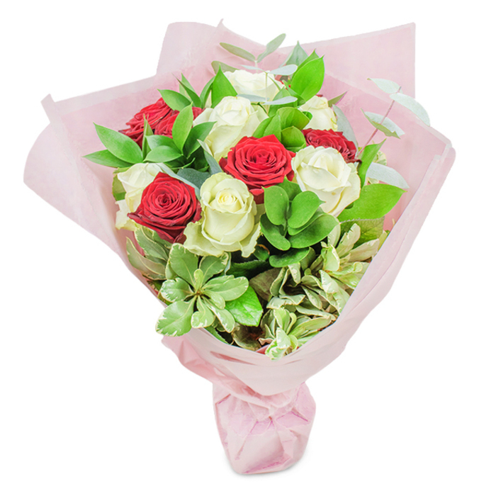 Against a pure white backdrop, this lush bouquet from Flowers Mill Hill showcases a refined interplay of colour and texture reminiscent of a stroll through the local parks and gardens that define this green, welcoming London enclave. Comprising around twenty perfect roses-a balanced mix of ten crimson and ten ivory blooms-each rose displays tightly furled petals and a fresh, dew-touched quality that bespeaks expert curation. Interspersed throughout are rich, glossy dark greens, lighter soft foliage, and elegant sprigs of eucalyptus and variegated leaves-a vibrant nod to the natural beauty surrounding The Broadway and Goodwyn Avenue. Encasing this abundant arrangement is a gentle sweep of pastel pink wrapping paper, softly gathered and tied to set off the florals within. The bouquet's composition, filled with romantic promise and classic charm, feels ideal for commemorating life's milestones: from anniversaries and engagements to heartfelt declarations or expressions of thanks. Each element, from the choice of roses to the detailed finishing of the wrap, speaks to the expert craftsmanship and local pride of your Mill Hill florist, making this bouquet a thoughtful reflection of the area's elegance and warmth.
