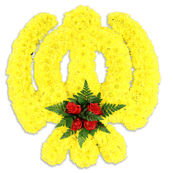 Presented with quiet dignity, this floral Khanda sits against a stark white background so its colours and symbolism read clearly and respectfully. The emblem is constructed from a dense field of bright yellow chrysanthemum heads, each small bloom positioned precisely to follow the emblem's curves - the chakkar's circular sweep, the straight, central double-edged sword and the two crossed kirpans beneath - producing a unified surface that feels both tactile and luminous. At the focal point, where the circular quoit would meet the sword, a tight cluster of rich, deep red roses is nestled into a bed of dark green fern leaves; the roses' plush petals and the ferns' serrated texture form a deliberate contrast that draws the eye and lends warmth to the piece. The studio lighting casts a soft shadow under the arrangement, suggesting a freestanding tribute suitable for memorial services, Gurdwara ceremonies, or cultural remembrances around Mill Hill Village, The Ridgeway and neighbouring streets. The faint, clean scent of fresh chrysanthemums and roses seems to hover in the air, offering a quiet comfort. Crafted with sensitivity and traditional technique, the design honours Sikh symbolism of bravery and unity while remaining tender in tone - a floral offering many families request when marking a life or commemorating a community event. Flowers Mill Hill prepares similar tributes for local delivery across Mill Hill and nearby wards, tailored for solemn occasions and cultural observances.