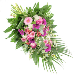 This elegant funeral spray is presented on a white background, arranged in a flowing diagonal from the upper left to the lower right as if gently leaning into a final farewell. At the top left, the natural green stems are neatly bound, showing the structural heart of the piece. From here, the flowers and foliage fan out into a lush, cascading design that would look at home in a Mill Hill memorial service or resting beside a chapel along Lawrence Street. Prominent within the arrangement are large gerbera daisies, some in delicate pastel pink and others in stronger fuchsia or deep magenta, their circular forms and layered petals creating confident focal points. Interwoven with these are classic pink roses, their tightly spiralled centres and slightly cupped outer petals adding refinement and an air of timeless sentiment. The deeper tones are balanced by clusters of white ruffled blooms-probably carnations or small chrysanthemums-that bring light, soft texture to the composition. Threaded gently throughout are tiny white daisy-like flowers, evoking a sense of innocence and quiet hopefulness. Bright red hypericum berries are tucked among the blossoms, providing small bursts of colour and a smooth, bead-like contrast to the softness of the petals. The entire spray is supported by a rich base of greenery: broad, glossy dark green leaves offering strength and depth, feathery bright green ferns bringing a touch of woodland lightness, and round, silvery eucalyptus leaves lending a subtle, contemporary feel and fresh aroma. From the lower right, long, dark green palm leaves extend and curve outward, underlining the cascading, diagonal flow. The result is a dignified, expressive sympathy tribute that conveys comfort, remembrance, and respect, suitable for delivery across Mill Hill, from local churches to family homes paying their last respects.