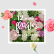 A romantic, inviting bouquet of roses is the focus of this image, conveying the essence of a year-long journey through colour and scent. The flowers form a generous, rounded arrangement filled with blossoms in blush pink, creamy white, delicate lilac, and vibrant fuchsia, their petals layered so closely that they seem to murmur against one another. Some roses are fully open, displaying their swirling centres like carefully crafted rosettes, while others linger as buds, promising the freshness of tomorrow's blooms. The bouquet is cradled by lush, green foliage, whose smooth, glossy leaves create a rich backdrop that makes the pastel tones glow even more. Set against a pale, neutral background, the flowers appear to float, and this impression is echoed by the loose petals and occasional blossoms dancing around the edges of the frame, as though caught mid-air while the bouquet is prepared for another monthly delivery. This visual rhythm mirrors the pattern of a 12-month flower subscription: each month bringing a new wave of beauty to a home in Mill Hill, whether placed in a bay window overlooking local gardens or on a kitchen table near Mill Hill Park. The image invites you to imagine the gentle, velvety texture of the petals, the cool firmness of the stems, and the subtle, uplifting fragrance that a fresh rose bouquet releases when it first arrives. It reflects the thoughtful artistry of Flowers Mill Hill, suggesting arrangements crafted with local knowledge and care, ideal for marking milestones or simply keeping a steady thread of joy running through everyday life.