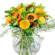 A vivid ode to sunshine and celebration, this lush bouquet brings together the brightest yellows and freshest greens in a design inspired by the warmth of Mill Hill. The stars are radiant sunflowers, their broad, honey-gold petals and deep brown eyes recalling joyful days spent in Mill Hill Park or strolling along Bunns Lane. Nestled between these iconic blooms, yellow garden roses unfold in plush, spiraled layers, their subtle perfume lifted by the gentle movement of the arrangement's airy ferns. Scattered throughout are clusters of glossy red hypericum berries, playful and bold, which dance amid the varied greenery-everything from soft fronds to slender stems and modern eucalyptus leaves shimmering with blue-green. Completing the display, a simple round glass vase reveals every fresh, green stem immersed in sparkling water, creating a look that is at once modern and timeless. Light pours across the surface, enhancing the golden tones and inviting a sense of welcome. Ideal for celebrations big or small-birthdays, milestones, or just to share spontaneous happiness across NW7-this hand-crafted bouquet brings Mill Hill's garden spirit indoors, delivering a touch of summer vitality and expert florist care to every recipient.