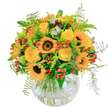 Glowing with the sunshine of a summer afternoon in Mill Hill, this bouquet evokes the joyful energy of leafy North London. At its centre, bold sunflowers flaunt their dark, velvety hearts, petals glowing like miniature beacons on the High Street. Intertwined among them, yellow roses unfurl in creamy, soft layers, every bloom a promise of joy and friendly gathering. Playful accents of vibrant orange and clusters of glossy red berries pop out from between waving ferns, recalling the cheerful bustle of the local Broadway farmers' market. Wisps of greenery arch gracefully, evoking the motion of breezes through Stoneyfields Park. Nestled in a clear, rounded glass vase, the stems create a natural tangle, inviting a touch of artistic spontaneity. The subtle, fresh fragrance of this arrangement lifts the spirit-making it perfect for cheerful birthdays, a generous thank-you, or simply welcoming the uplifting spirit of Mill Hill into any home, lovingly arranged by Flowers Mill Hill.