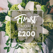 Rendered in white and lime green, this Florist Choice Bouquet is a striking fusion of purity and modern energy. The large white lilies command attention with expansive, velvety petals, while clusters of bright chartreuse greens add buoyant texture and volume, echoing the sparkle of hydrangea heads or Green Trick dianthus. Smaller white blossoms-ranunculus or spray roses-are tucked among the stems, their soft forms lending tactful rhythm to the composition, and dark green foliage threads through to anchor the design. The bouquet appears hand tied, the stems gathered with care, and a hint of a pale wedding gown is visible in the softly blurred background, making the moment feel intimate and celebratory. A white framed overlay sits at the center of the image, bearing the brand with Florist Choice Bouquet in flowing script and the price shown boldly at the bottom, signaling a premium gift from Flowers Mill Hill.
From Flowers Mill Hill, this arrangement is framed as a luxury gift with practical appeal: available for same-day or next-day delivery across Mill Hill, Church End, Finchley, and neighboring streets, bringing high-end floristry to life for weddings, anniversaries, or meaningful milestones. The bouquet's white and lime palette offers versatility for ceremonies or elegant congratulatory moments, while the design's clean lines and lush greenery speak to the florist's artistry and commitment to freshness.