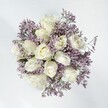 This Mill Hill bouquet is the very definition of serene elegance: full, creamy white roses unfurl their velvety petals under the delicate embrace of lavender statice. Each rose gleams softly in natural daylight, heart open, surrounded by cascades of lavender florets that mimic the drifting mists seen over Mill Hill's early-morning Green Belt landscapes. The combination creates a quietly enchanting palette, where the smoothness of the rose petals is accented by the papery, intricate texture of the statice, resulting in a composition that exudes grace and hope. Light flows over every curve, making it a perfect accompaniment for intimate events such as weddings at Mill Hill Synagogue, anniversaries at home, or simple moments of solace. An airy, almost powdery fragrance rises from the bouquet, hinting at freshly cut meadows and tranquil mornings near the Ridgeway. Lovingly arranged by local florists, this bouquet stands as a sincere promise of affection and calm, perfectly capturing the gentle spirit of Mill Hill.