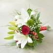 Lying diagonally on a softly illuminated, textured canvas, this lush bouquet from Mill Hill showcases the florist's artistry in every petal and leaf. Striking white lilies, their large trumpet-shaped flowers wide open, are partnered with elegant lime-green buds, teasing the promise of future blooms. At the centre, a single deep red rose unfurls in perfect symmetry, delivering a dramatic burst of colour and classic romance within a field of white. Mossy, rounded clusters of green trick dianthus create plush visual interest, hinting at the natural richness of the local area. Sprigs of ethereal baby's breath offer a soft veil, balancing the bold blooms with an airy finesse, while clusters of shining, scarlet hypericum berries infuse a joyful spark. A glorious frame of mixed greenery, with both broad, dark leaves and feathery light ones, evokes the lush parks and gardens of Mill Hill. The stems, gathered and finished with a vivid scarlet satin ribbon, lend a festive and unified polish perfect for marking weddings, anniversaries, or simply celebrating beauty in everyday moments. Available for same-day delivery throughout Mill Hill, this bouquet conveys warmth, joy, and contemporary flair in every carefully considered detail.
