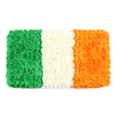 From a sun-warmed corner of Mill Hill, this rectangular floral banner reimagines the Irish tricolour-An Bhratach Náisiúnta-against a clean white backdrop. The composition is a deliberate mosaic of countless fresh petals, arranged into three equal vertical bands with flag-like precision. The left-hand stripe glows in a deep emerald green, a plush carpet of tiny green carnations or chrysanthemums whose slightly uneven surface reveals the individual clusters and the florists' patient hand. This green nods to Irish Catholic heritage and the spirit of nationalism.

To the center, a crisp white band of tightly packed white petals appears soft and cloud-like, catching the light and separating the other colours with quiet dignity. The white stripe's texture is almost tactile in its softness, inviting the eye to linger on the moment of pause between tradition and hope.

On the right, the bright orange stripe mirrors the same careful texture, formed from numerous tiny orange flowers-perhaps marigolds or orange chrysanthemums-that give the stripe a warm, sunlit glow. The entire arrangement sits on a pure white background, the colours luminous and tactile, a handcrafted celebration of culture and craft. For a Mill Hill audience, the flag evokes St Patrick's Day, community gatherings, and quiet moments of reflection in local churches and markets around Mill Hill Broadway and Copthall Playing Fields. Made by Flowers Mill Hill, this tribute blends traditional symbolism with contemporary floristry, offering a visually striking piece for articles about Irish identity, national holidays, or the symbolism of colour in nature.