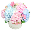 This pastel reverie is a poem of spring in Mill Hill, a round white hatbox cradling a lush, fragrant dome of blooms. The arrangement is built from plush pink peonies and airy baby-blue hydrangeas, their petals catching the light as if each were a soft-held secret. Surrounding them, pale pink spray roses glimmer with quiet innocence, and two calla lilies-one near the top-left, one near the bottom-right-stand tall, trumpet-shaped and full of color. Hints of soft green foliage, hydrangea leaves, and the silvery sheen of dusty miller weave through the bouquet, giving depth, texture, and a touch of woodland calm. The dome shape is sculpted and balanced, so the entire bouquet reads as a single, radiant sculpture rather than a collection of flowers, set against a clean white background. It feels like a thoughtful gift for anniversaries or birthdays, a romantic gesture that also suits a baby shower or gender reveal, or simply a celebration of beauty. The scent lingers-a gentle perfume from peonies blending with the cool, fresh note of hydrangea-soft and inviting. Delivered from our studio in Mill Hill, this bouquet can bring a moment of luxury to homes across the NW7 district, with same-day delivery available to friends and family on the day you choose. Flowers Mill Hill crafts each piece with care, ensuring the bloom's freshness and a lasting impression that speaks of expertise, locality, and heartfelt care.