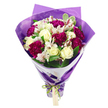 This image presents a beautifully composed bouquet that seems to glow against its stark white background, every bloom and ribbon telling a quiet story of celebration and care. The arrangement is built in a classic hand-tied style, rounded and full at the top where the flowers cluster tightly, then gently narrowing as the stems descend, as if it has just been lifted from a vase in a Mill Hill living room. Creamy white roses anchor the design; their velvety petals are arranged in elegant spirals, opening slightly to reveal soft, layered centres that suggest calm and tenderness. Nestled closely among them, deep magenta carnations offer a burst of colour and texture. Their many ruffled petals form densely packed blooms that look almost like small, richly coloured pom-poms, bringing warmth and vibrancy to the palette. Between these, white alstroemeria add a more delicate note, with slim petals subtly streaked with pinkish-red lines and dotted markings, while their darker stamens stand upright in the middle, introducing a fine, linear detail. Fresh green foliage interlaces and frames the flowers, its varying shapes and the occasional variegated leaf adding a sense of natural ease, echoing the greenery found in Mill Hill's parks and gardens. The stems are wrapped first in crisp white paper that forms a neat collar, giving the bouquet a tailored, polished look. Over this, a layer of translucent, gently crinkled purple cellophane or tissue wraps around, catching the light and adding depth and a festive glimmer. At the base, an iridescent green satin ribbon is tied into a tidy bow, securing the stems. A small, rectangular kraft-style gift tag hangs from the ribbon, blank and inviting, ready to be inscribed for a birthday, anniversary, or heartfelt thank-you, perhaps delivered to a home near Mill Hill Broadway or along Bunns Lane.