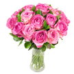 A lush, perfectly rounded dome of roughly two dozen fresh pink roses fills a clear glass vase, photographed against a pure white background so every petal and leaf reads with clarity. Each bloom carries a gentle ombré - deeper fuchsia or magenta at the tightly furled heart, graduating outward to soft blush pink and, on some outer petals, a whisper of creamy ivory. The roses are arranged close together so their velvety petals overlap in a dense, tactile surface; between the flowers, smooth dark-green leaves peek through, their glossy texture grounding the composition and giving the bouquet natural rhythm. Through the transparent vase the neatly cut green stems are visible, submerged in crystal-clear water that suggests freshness and careful handling. Bright, even lighting sculpts each spiral of petals and casts delicate highlights along the curves, making the arrangement feel both immediate and intimate. Imagine the faint, sweet scent of garden roses rising from the cluster - a green, fruity perfume that evokes early summer mornings in nearby Mill Hill Park and quiet walks through Mill Hill Village. As a florist describing this piece to someone who cannot see it, I'd note the confident, traditional silhouette that nonetheless reads contemporary on a mantel or dining table; it's the kind of bouquet for anniversaries, Mother's Day, or a heartfelt 'I love you.' For neighbours in the NW7 area, this arrangement offers a fresh, elegant statement that balances classic romance with seasonal vitality and local character.